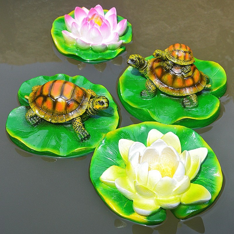 Turtle resin ornaments floating on the water surface — image 8