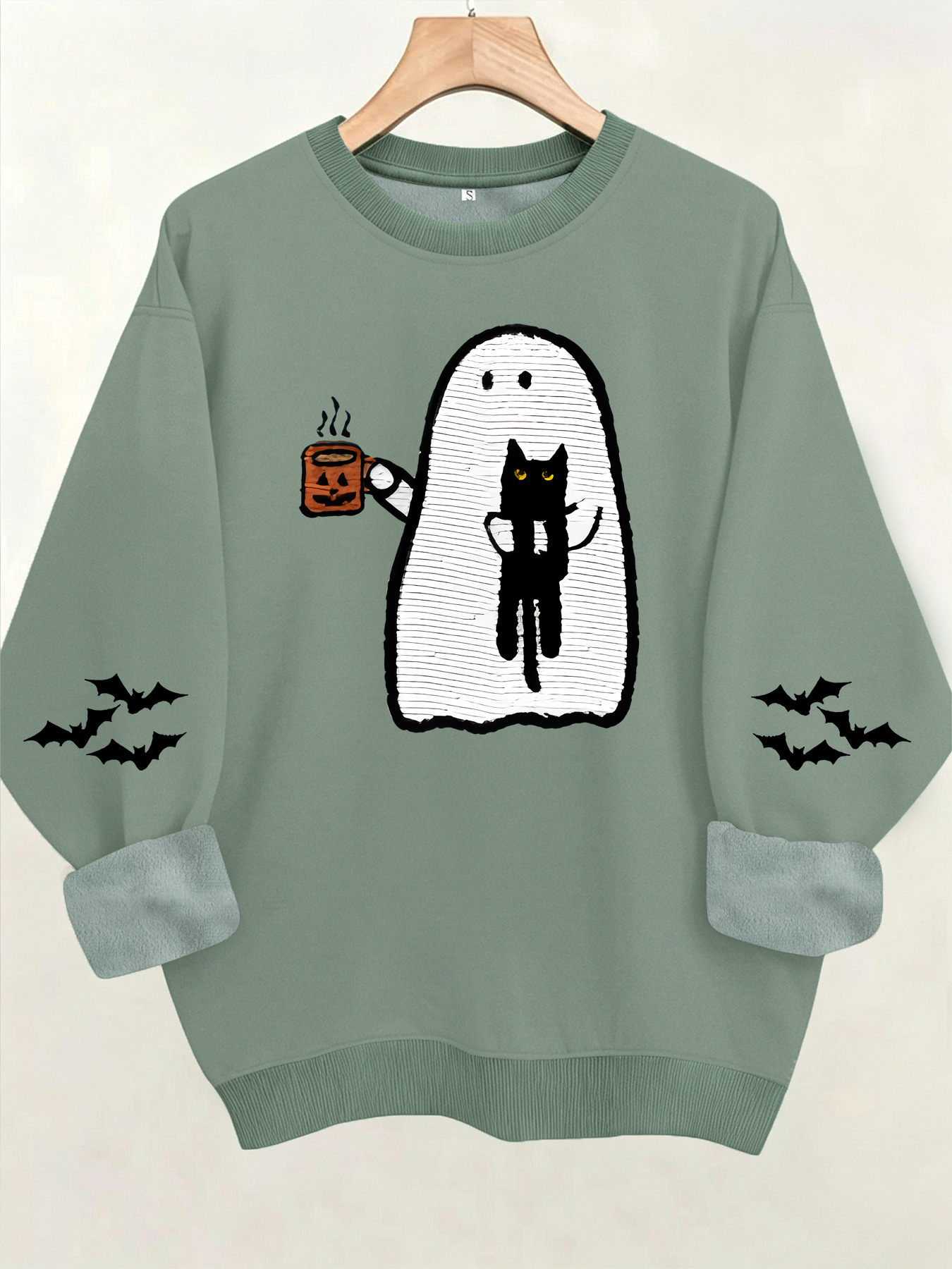 Ghost holding black cat with fleece hoodie — image 9