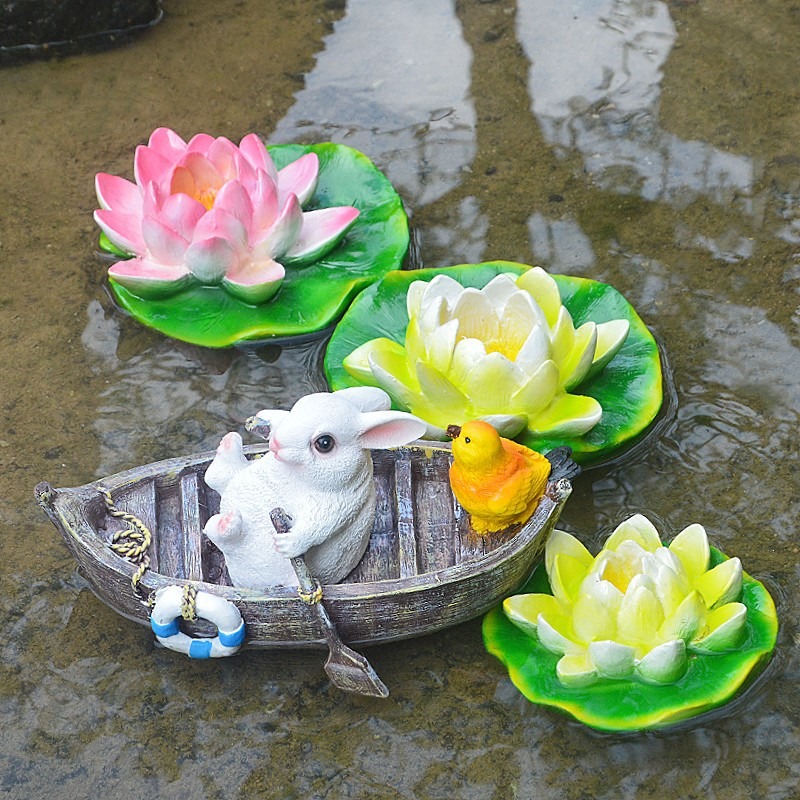 A rowing rabbit resin ornament floating on the water surface — image 9