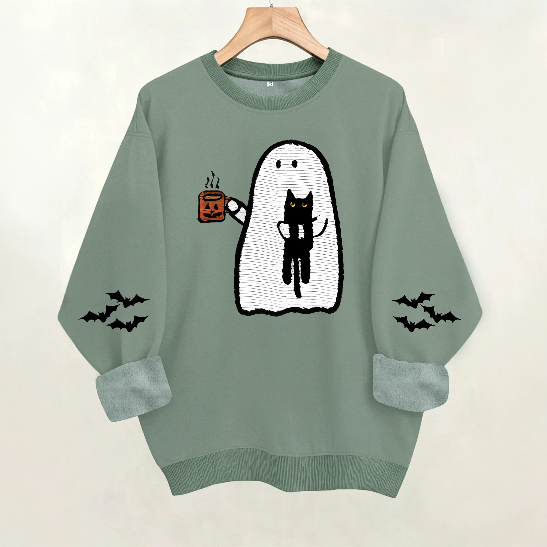 Ghost holding black cat with fleece hoodie — image 6