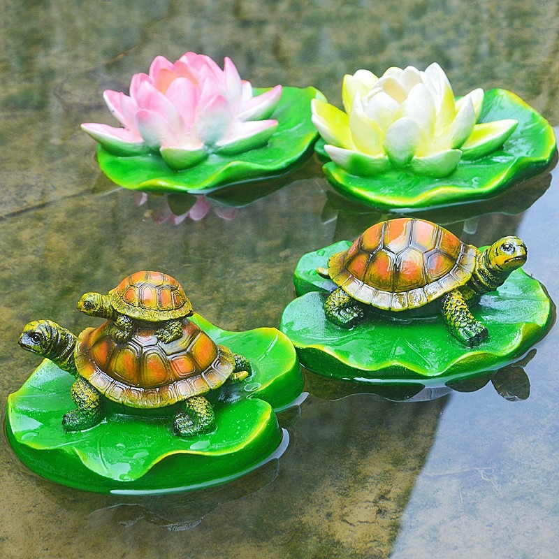 Turtle resin ornaments floating on the water surface — image 9