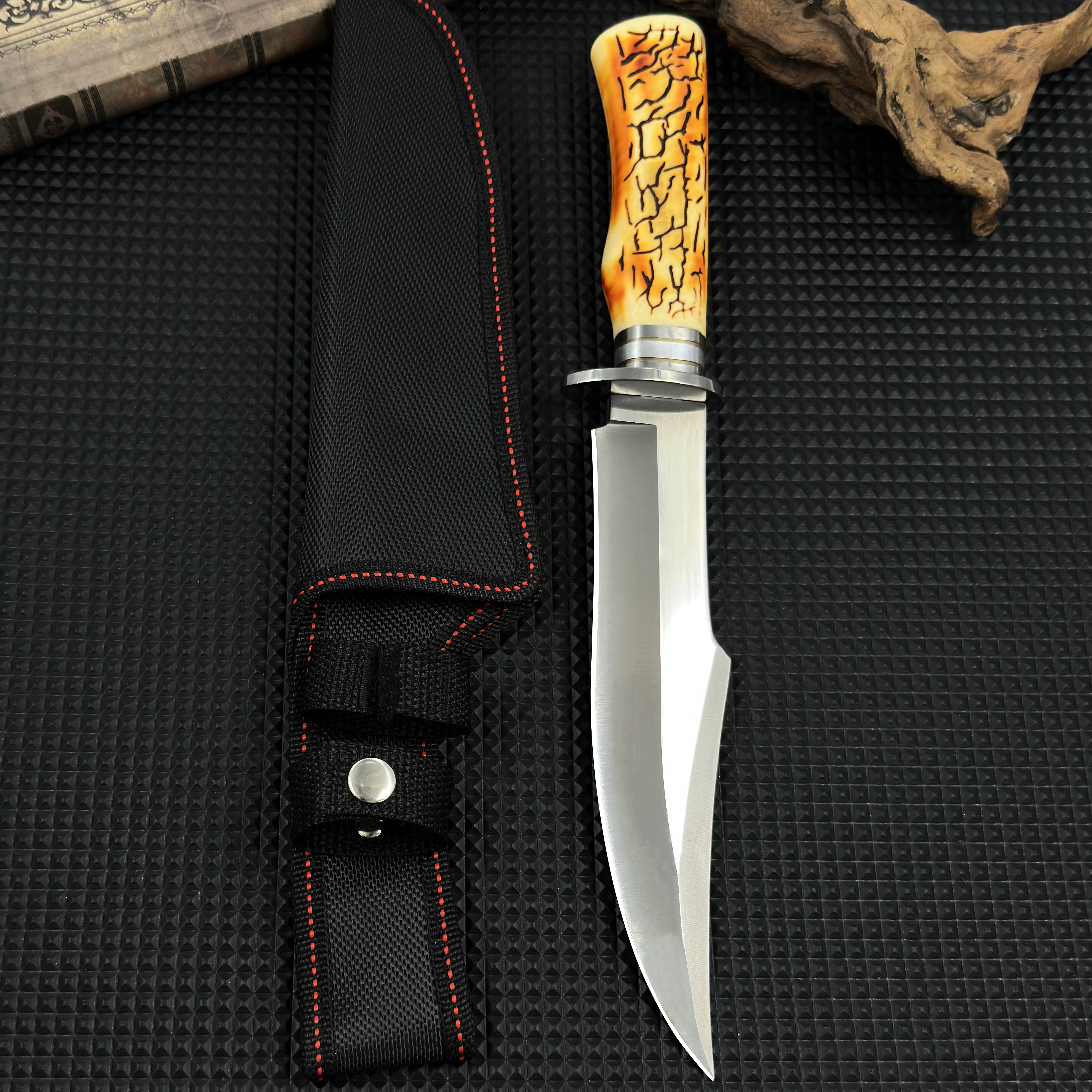 This stainless steel survival knife, equipped with a durable sheath, is invaluable for constructing shelters during outdoor — image 4