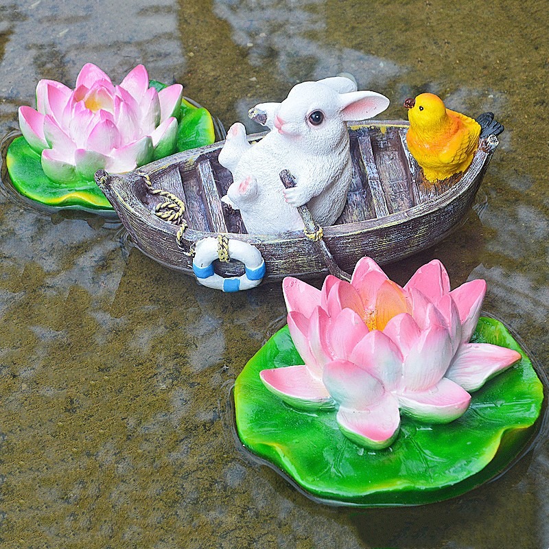 A rowing rabbit resin ornament floating on the water surface — image 7