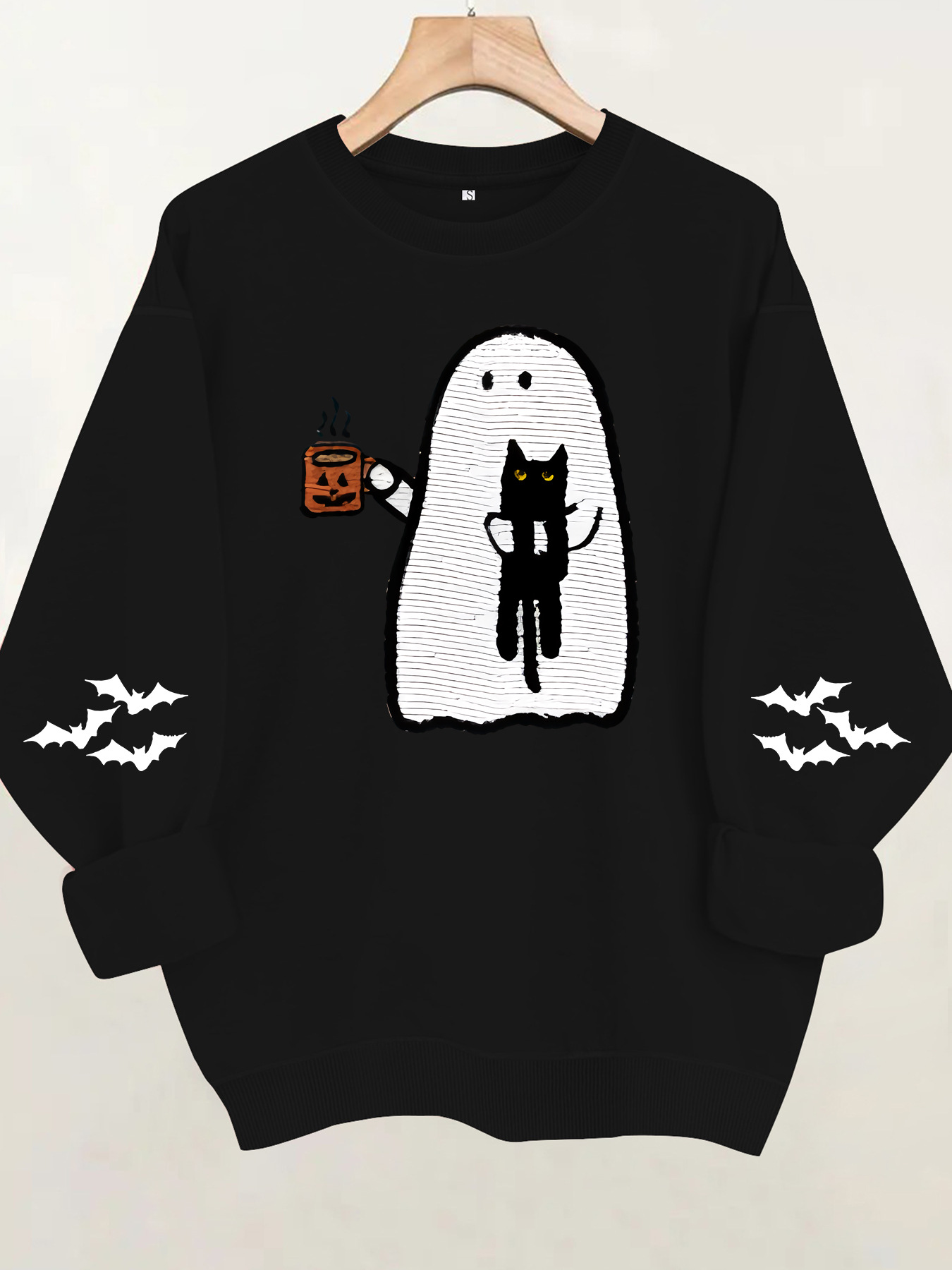 Ghost holding black cat with fleece hoodie — image 10