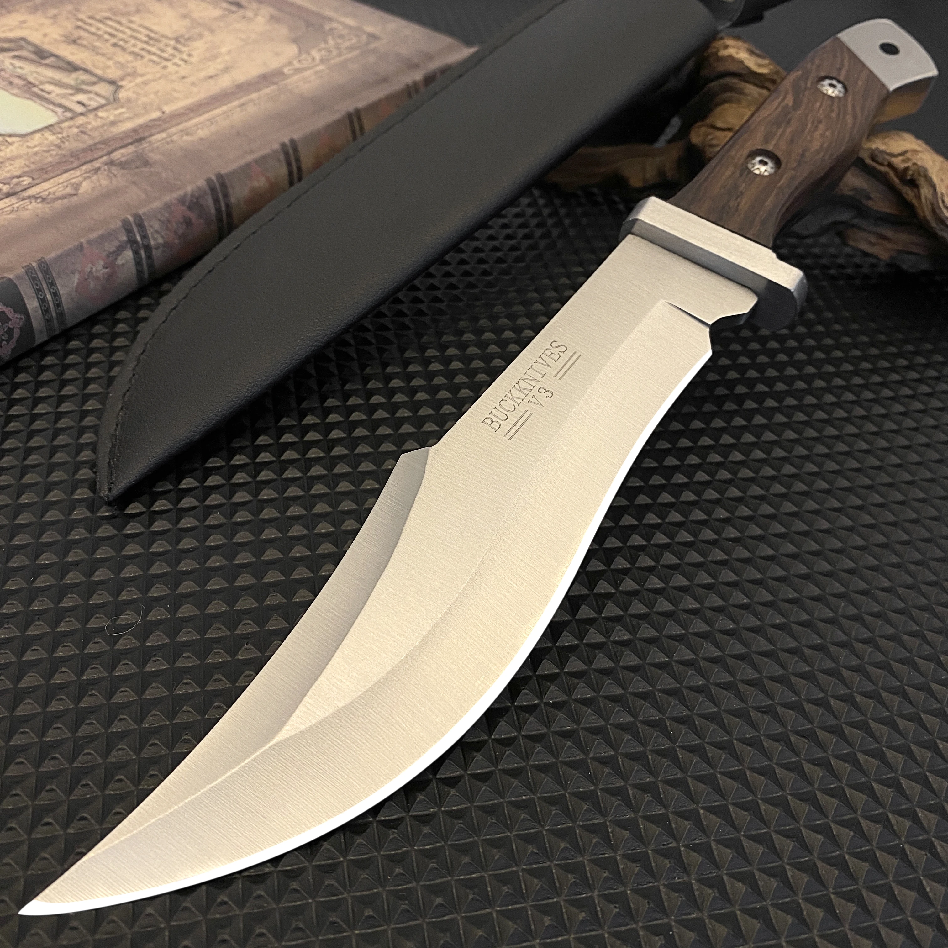 Stainless steel hunting knife with a wooden handle, paired with a black leather sheath, an essential tool for adventurers — image 1