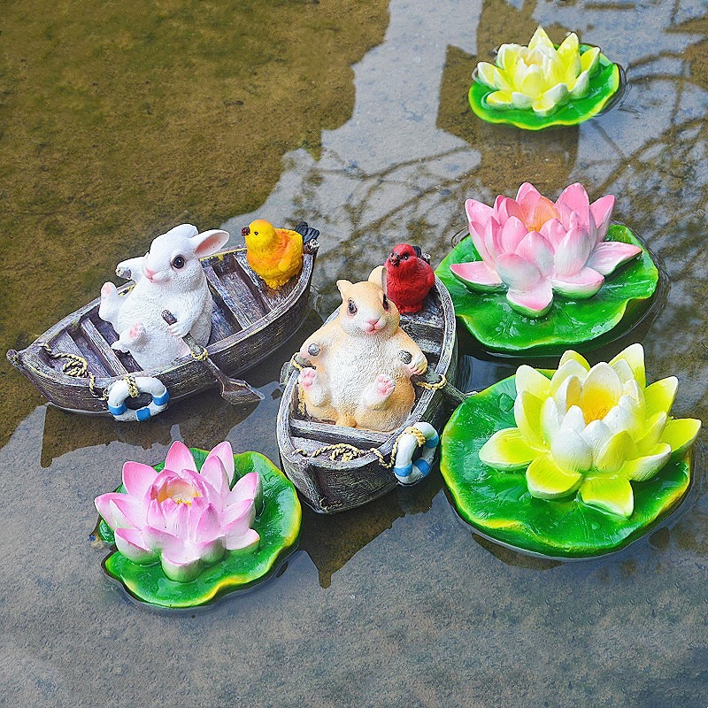 A rowing rabbit resin ornament floating on the water surface — image 8