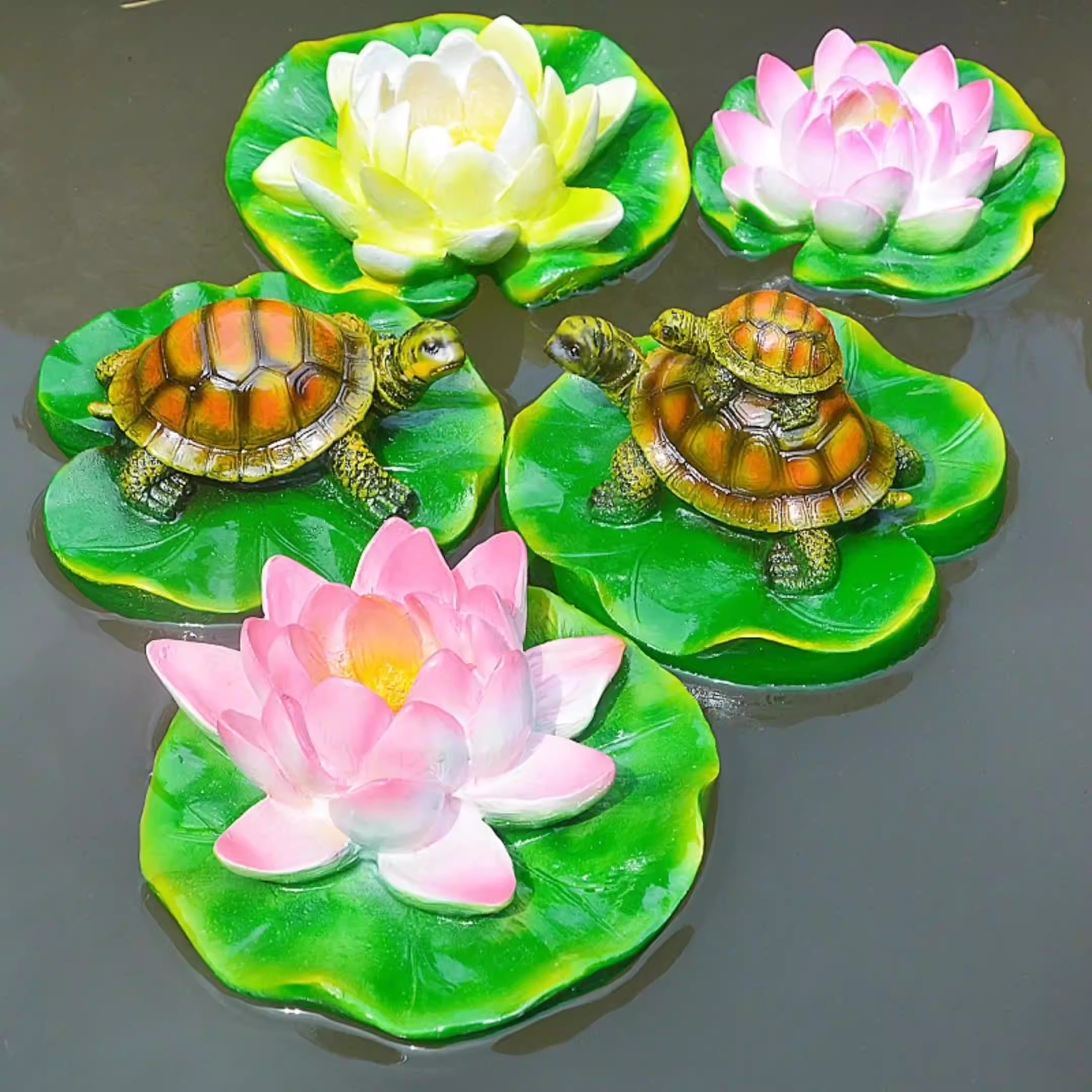 Turtle resin ornaments floating on the water surface — image 10