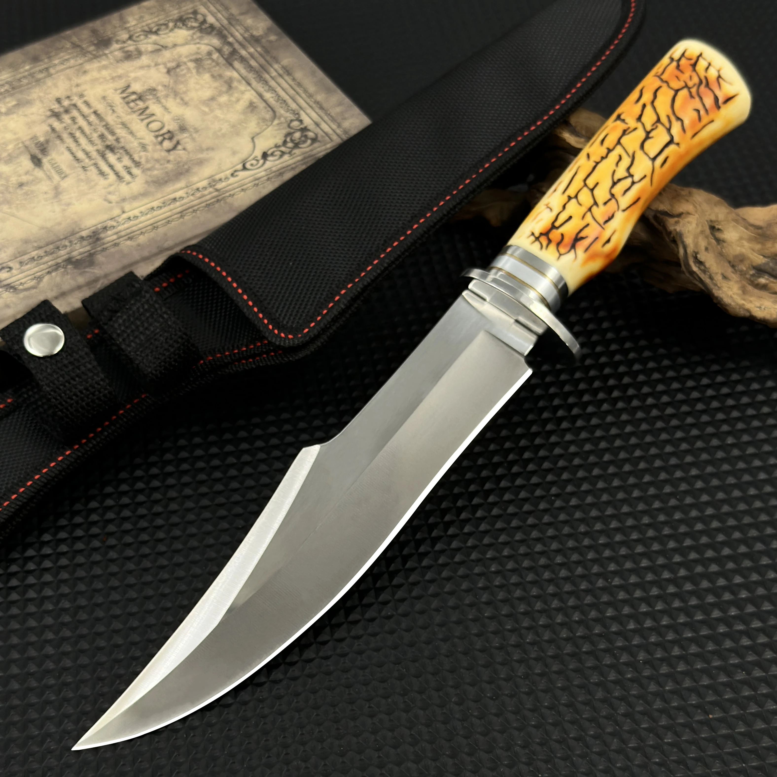 This stainless steel survival knife, equipped with a durable sheath, is invaluable for constructing shelters during outdoor — image 1