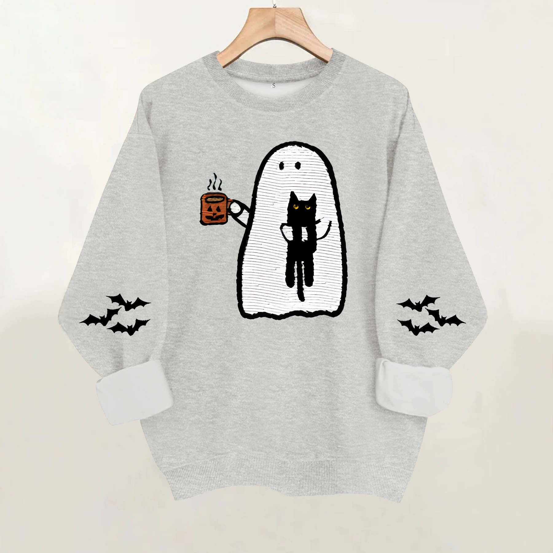Ghost holding black cat with fleece hoodie — image 3