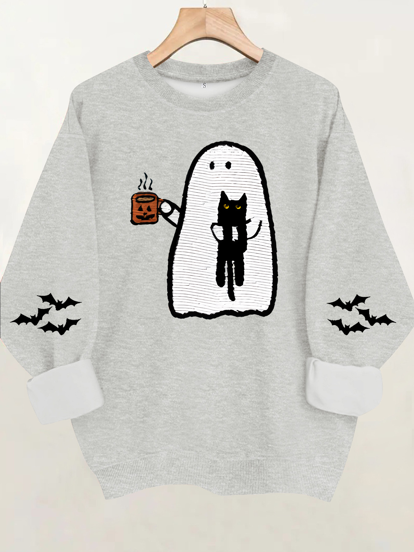 Ghost holding black cat with fleece hoodie — image 11
