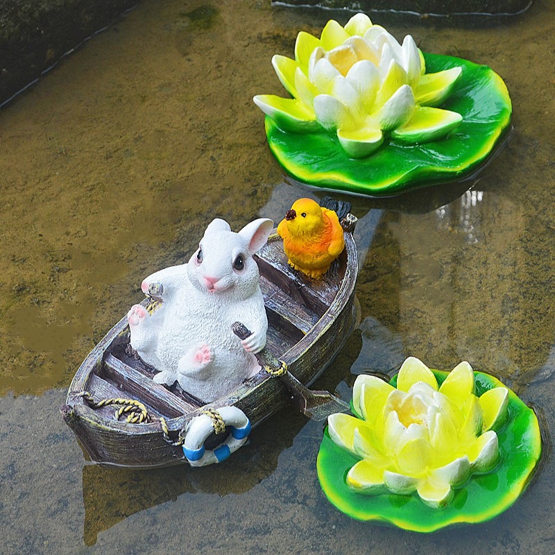 A rowing rabbit resin ornament floating on the water surface — image 6