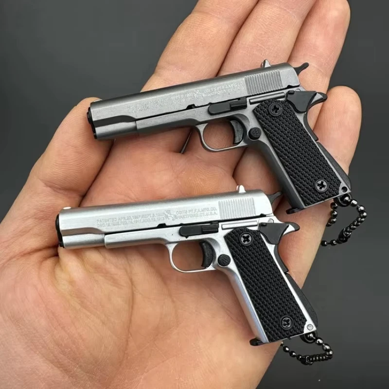 Pistola Colt 1911 PUBG a Escala 1:3, Modelo de Pistola Táctica Desmontable de Metal, Llavero de Aleación para Colección, Decoración Colgante, Regalo — imagen 1