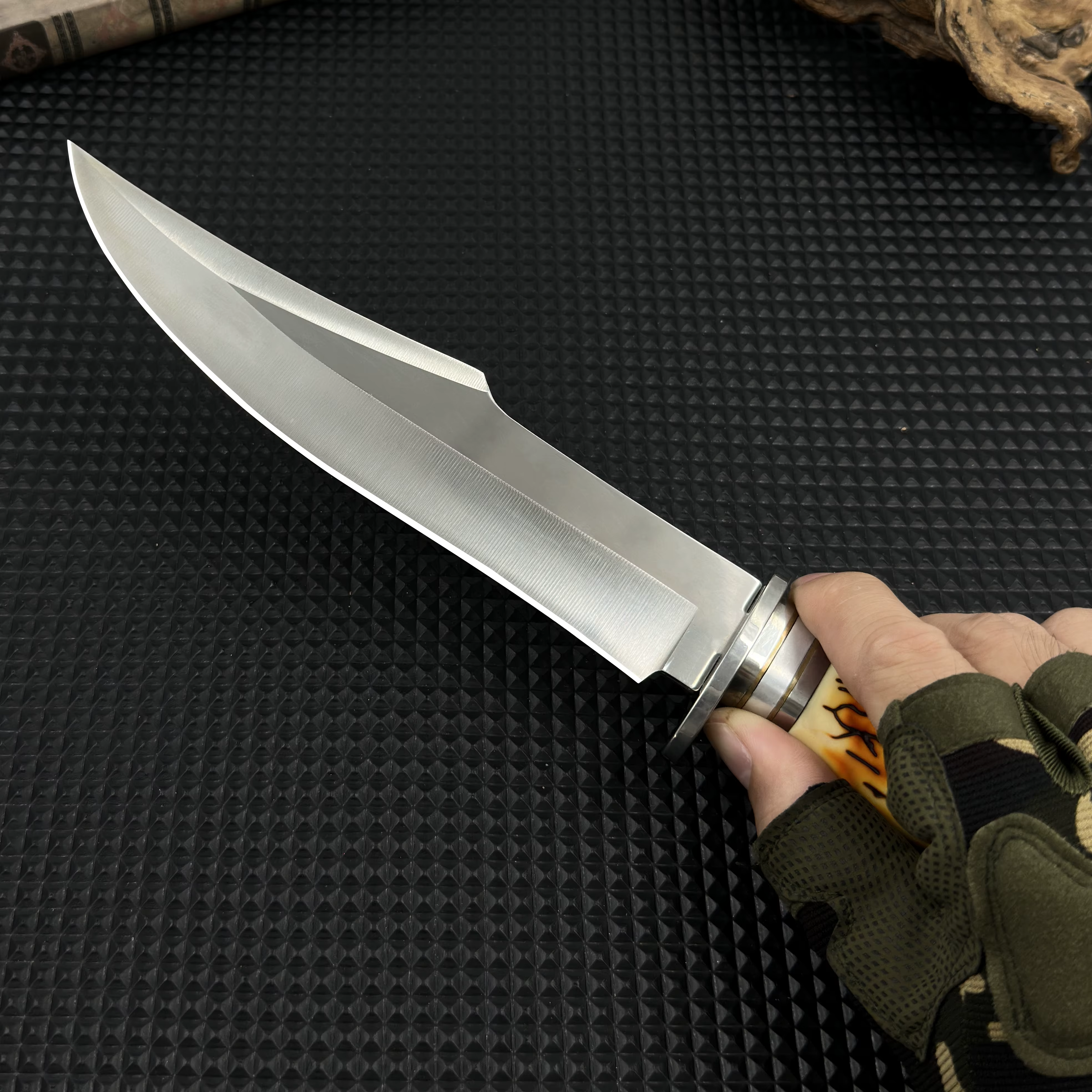 This stainless steel survival knife, equipped with a durable sheath, is invaluable for constructing shelters during outdoor — image 2