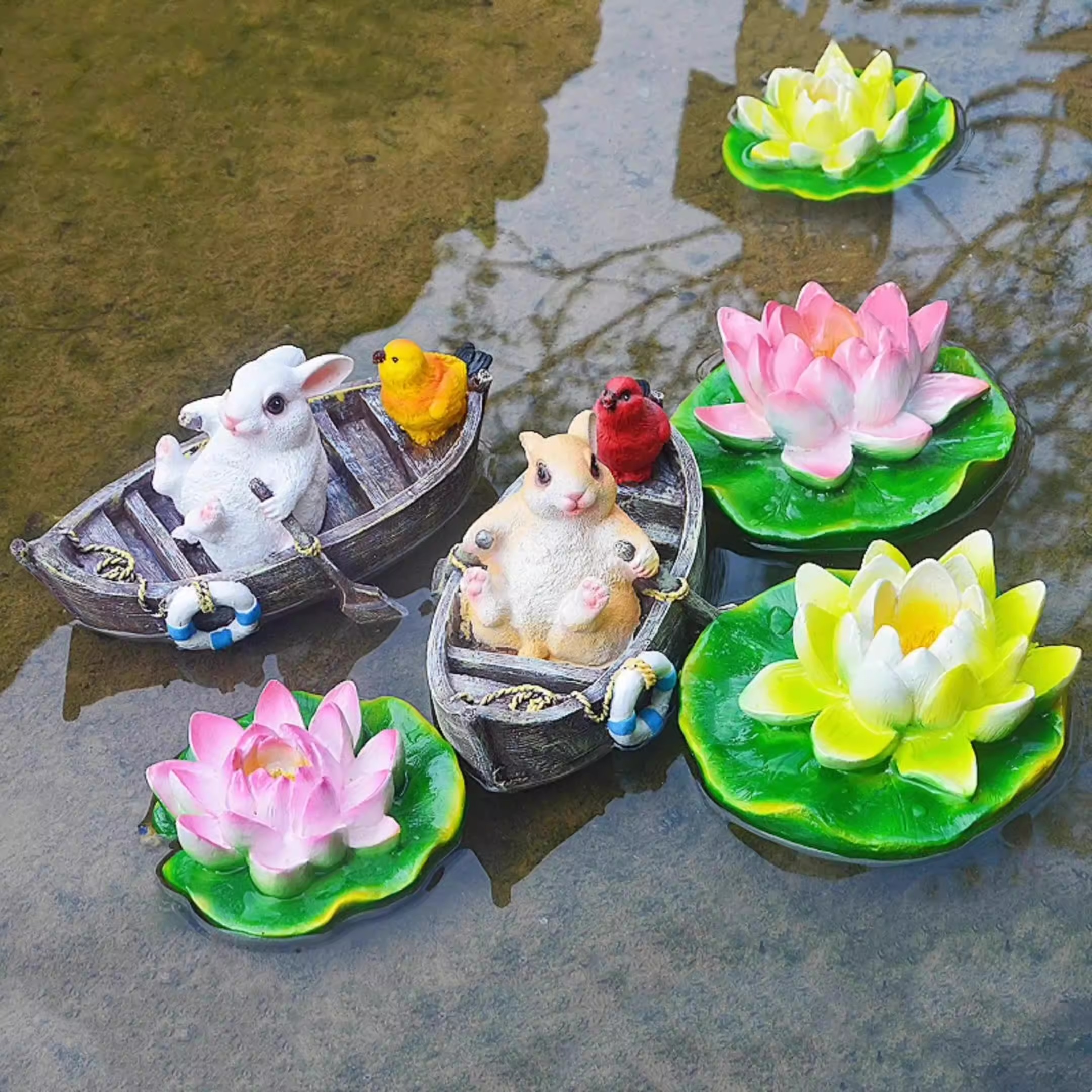 A rowing rabbit resin ornament floating on the water surface — image 10
