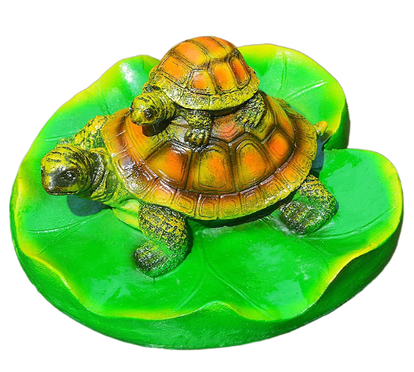 Turtle resin ornaments floating on the water surface — image 1