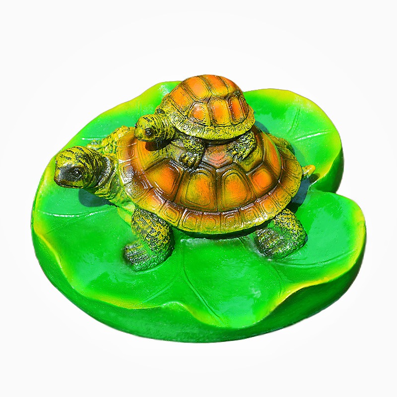 Turtle resin ornaments floating on the water surface — image 5